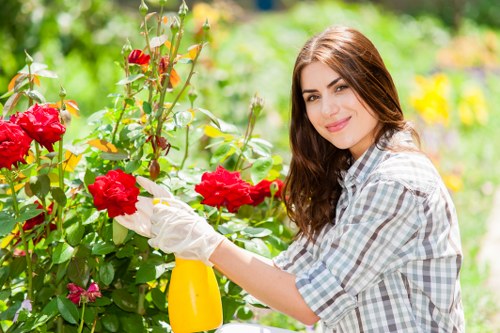 Close-up of a homeowner explaining a garden issue with notes