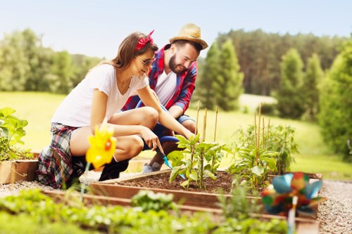 Professional gardener planting flowers in Walthamstow